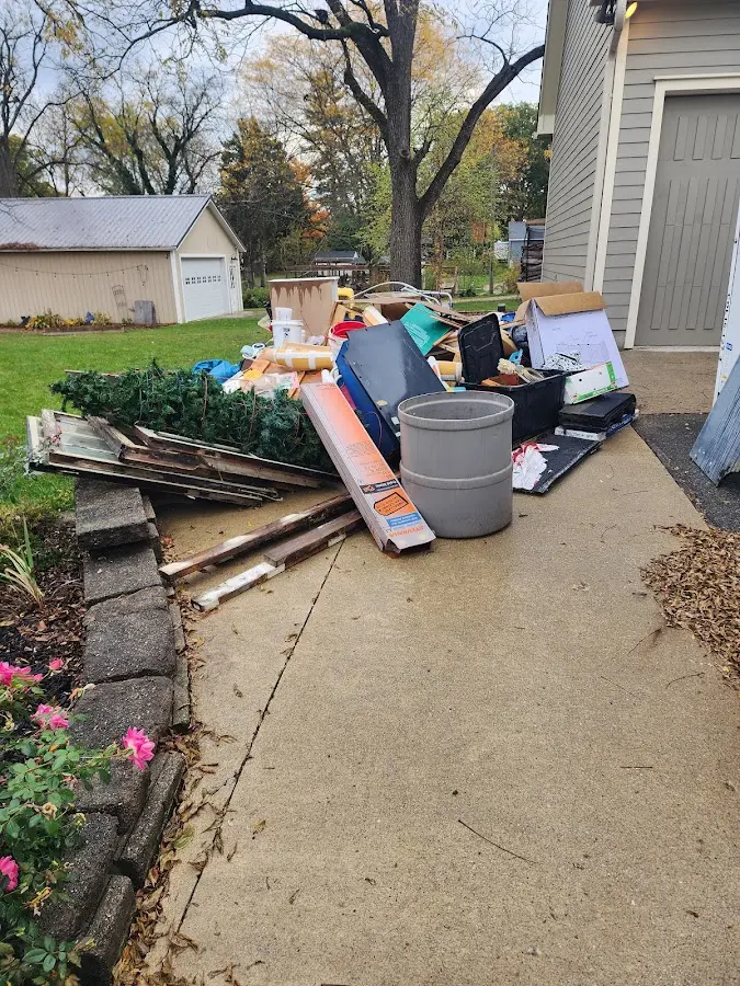 Dumpster being loaded with debris for 10 Yard Dumpster Rental in Hopewell